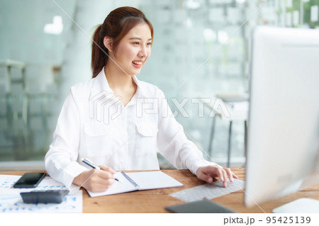data analysis, plan, marketing, accounting, audit, Portrait of asian business woman planning marketing using statistical data sheet and computer to present marketing plan project at meeting 95425139