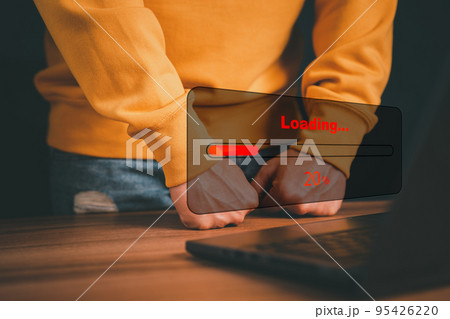 Man using laptop for download and waiting to loading digital business data form website, concept of waiting for load of loading bar. 95426220