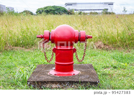 Red fire hydrants on the roadside in the community area are used to extinguish fires in the event of a fire. 95427383