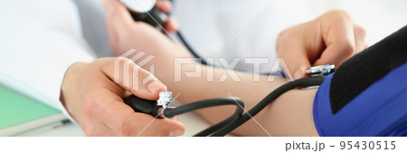 Doctor check blood pressure of patient in clinic, risk of hypertension, prevent disease Doctor check blood pressure of patient in clinic, risk of hypertension, prevent disease 95430515