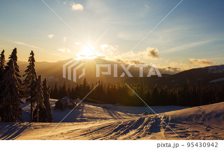 Sunrise in the mountains. Beautiful view of the mountains from a high point. Dawn in mountain landscape. 95430942