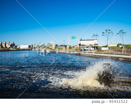 fish ponds dam is fenced off from big lake. industry of fish farming in Asia 95431522