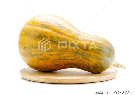Ripe pumpkin on wooden tray isolated on white background. 95432726