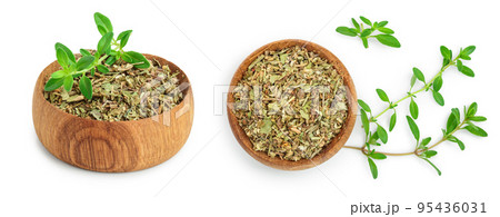 Dried thyme leaves in the wooden bowl, with fresh thyme isolated on white background Dried thyme leaves in the wooden bowl, with fresh thyme isolated on white background 95436031