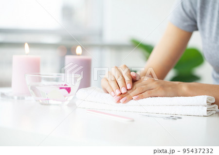 Young woman doing manicure from at home Young woman doing manicure from at home 95437232