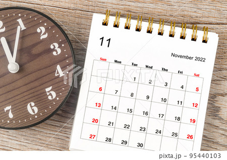 The November 2022 Monthly desk calendar for 2022 year with clock. 95440103