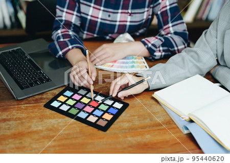 A group of professional web developer and graphic designer working together in the office. A group of professional web developer and graphic designer working together in the office. 95440620
