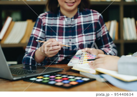 A group of professional web developer and graphic designer working together in the office. 95440634