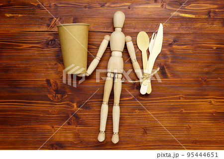 Environmentally friendly, disposable, cardboard, paper utensils, spoons, forks on beige background. Zero waste Environmentally friendly, disposable, cardboard, paper utensils, spoons, forks on beige background. Zero waste 95444651