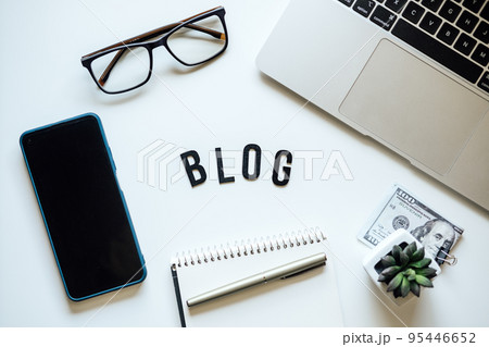 How To Start Blog, Blogging for Beginners. Ways to monetize your blog. Blog word on table with laptop, smartphone, open notebook, dollar banknotes and glasses 95446652