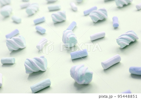Colorful marshmallow laid out on lime paper background. pastel creative textured pattern 95448851