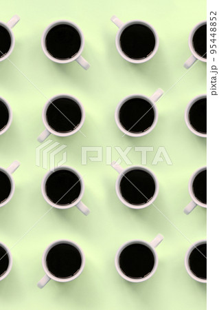 Many small white coffee cups on texture background of fashion pastel lime color paper Many small white coffee cups on texture background of fashion pastel lime color paper 95448852