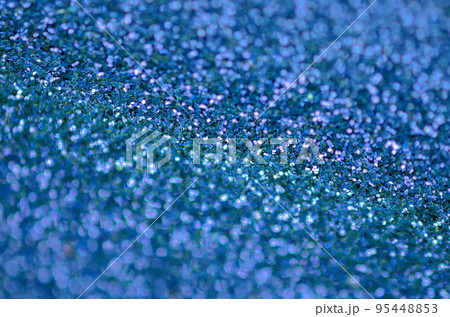 Blue decorative sequins. Background image with shiny bokeh lights from small elements Blue decorative sequins. Background image with shiny bokeh lights from small elements 95448853