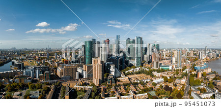 Aerial panoramic skyline view of Canary Wharf, the worlds leading financial district in London, UK. Business center of London. Aerial panoramic skyline view of Canary Wharf, the worlds leading financial district in London, UK. Business center of London. 95451073