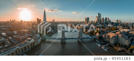 Aerial view of the London Tower Bridge at sunset. Sunset with beautiful clouds over London - the capital of Britain. 95451163