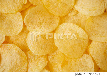 crispy potato chips snack texture background top view 95452158