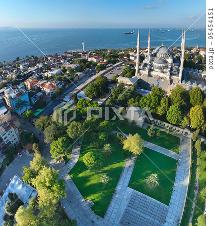 Istanbul, Turkey. Sultanahmet area with the Blue Mosque and the Hagia Sophia with a Golden Horn and Bosphorus bridge in the background at sunrise. Istanbul, Turkey. Sultanahmet area with the Blue Mosque and the Hagia Sophia with a Golden Horn and Bosphorus bridge in the background at sunrise. 95454151