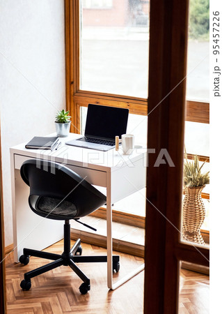 Cozy workplace on balcony. Home office space background. Cozy workplace on balcony. Home office space background. 95457226