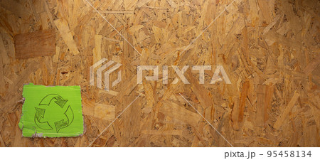 Recycle symbol on chipboard OSB background texture. Recycling idea concept Recycle symbol on chipboard OSB background texture. Recycling idea concept 95458134