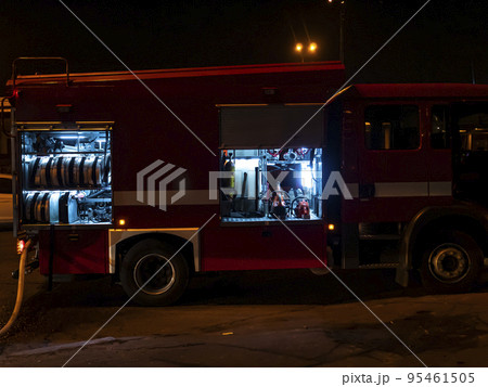 Fire engine during a fire extinguishing at night. Fire engine during a fire extinguishing at night. 95461505