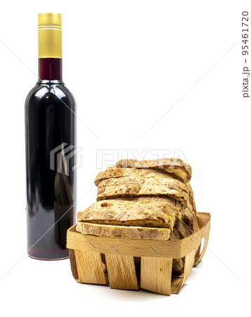 White bread and a bottle of red wine on a white background. White bread and a bottle of red wine on a white background. 95461720