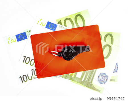 Red card of a football referee with money. 95461742