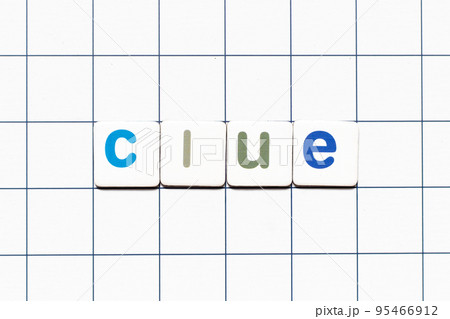Colorful tile letter in word clue on white grid background 95466912