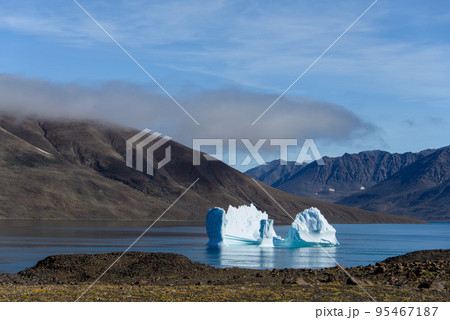 Beautiful landscape with iceberg in Greenland at summer time. Sunny weather. Beautiful landscape with iceberg in Greenland at summer time. Sunny weather. 95467187