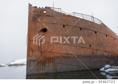 Old rusty wreck in Antarctic sea Old rusty wreck in Antarctic sea 95467723