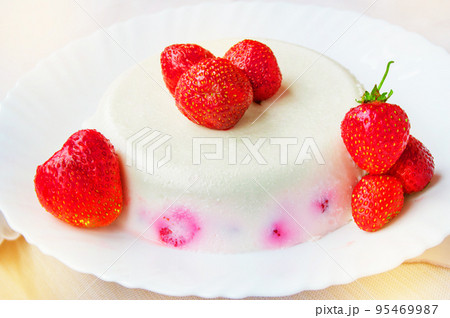Delicious homemade cake dessert cream with strawberries on a white plate, exquisite sweet food Delicious homemade cake dessert cream with strawberries on a white plate, exquisite sweet food 95469987