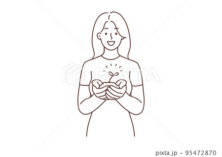 Smiling woman with seedling in hands  95472870