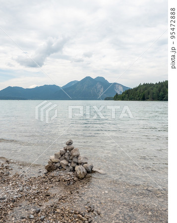 Lake shore. Balanced stones stack. Near Alps peak Lake shore. Balanced stones stack. Near Alps peak 95472888