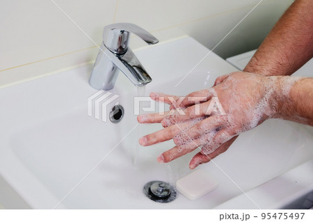 Hygiene and prevention of infection. Washing hands rubbing with soap man for corona virus prevention. Cleaning to stop spreading covid-19. 95475497