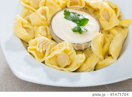 Boiled ravioli with sauce Boiled ravioli with sauce 95475704