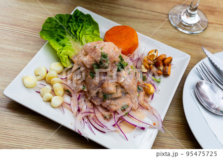 Peruvian ceviche from alaska pollock with onion and garlic 95475725