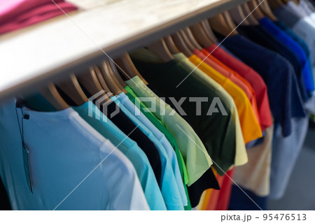 Assortment of summer clothing in modern store Assortment of summer clothing in modern store 95476513