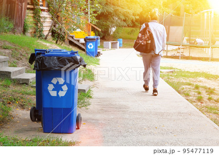 Waste recycling concept. Blue containers for further processing of garbage. Garbage collection, sign ecology. Sunshine. Waste recycling concept. Blue containers for further processing of garbage. Garbage collection, sign ecology. Sunshine. 95477119