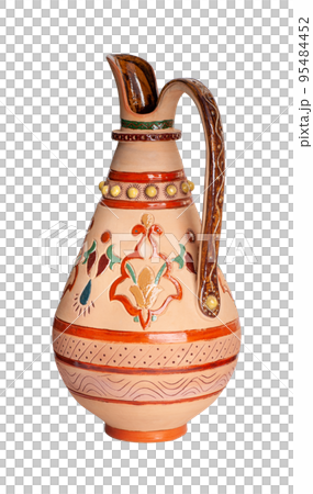 A vintage decorated ceramic jug isolated on a white background 95484452
