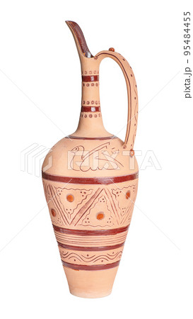 A vintage decorated ceramic jug isolated on a white background 95484455