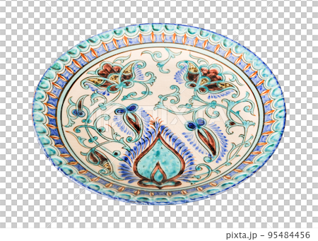 A vintage oriental ceramic plate isolated on a white background A vintage oriental ceramic plate isolated on a white background 95484456