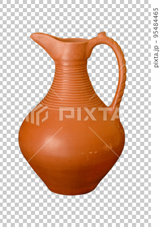 A brown clay jug isolated on a black background 95484465