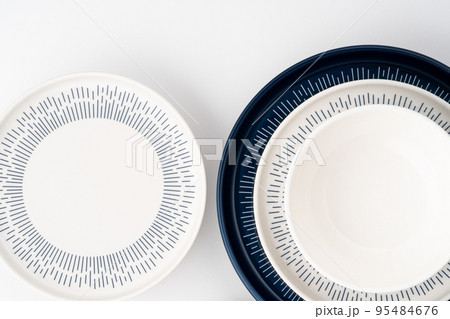 A set of blue and white luxury ceramic kitchen utensils on a white background 95484676