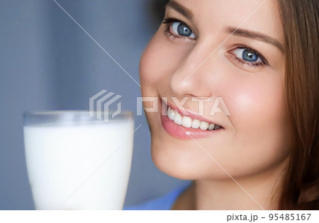 Happy young woman with glass of milk or protein milk shake, healthy cocktail drink for diet and wellness concept Happy young woman with glass of milk or protein milk shake, healthy cocktail drink for diet and wellness concept 95485167