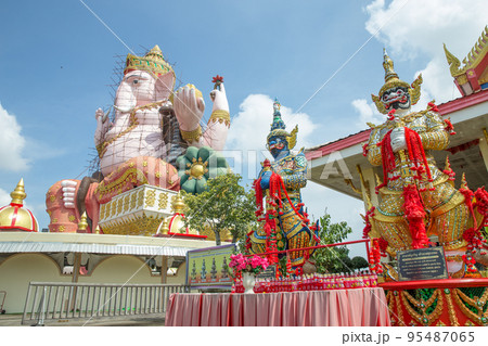Perspective of Lord Ganesha and Giant in Wat Pong Agas temple is a famous buddhist temple with a large golden pagoda in Thailand. 95487065