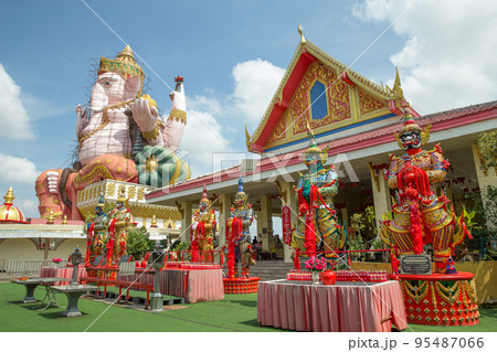 Perspective of Lord Ganesha and Giant in Wat Pong Agas temple is a famous buddhist temple with a large golden pagoda in Thailand. 95487066