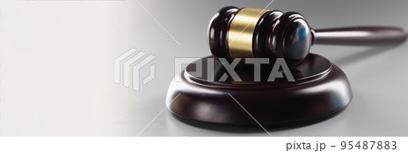 Judge black wooden hammer on soundboard on grey background, attorney instrument for legal service 95487883