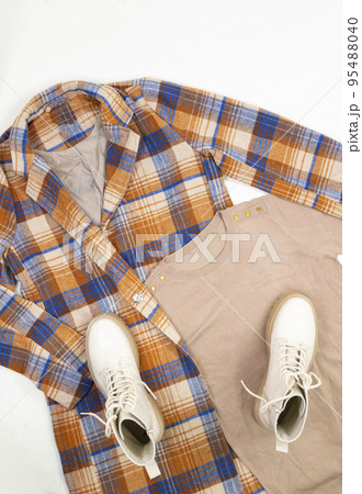 Flat lay, top view fashion style look with woman clothes and shoes. 95488040