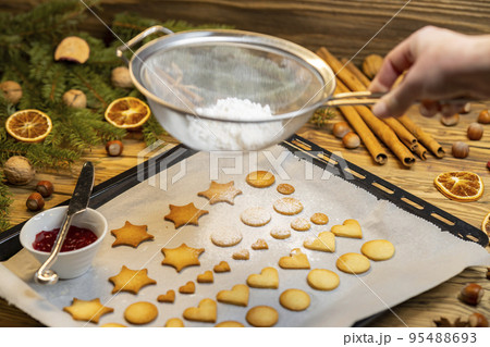Christmas linzer cookies on the baking tray Christmas linzer cookies on the baking tray 95488693