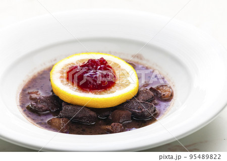 venison goulash with lemon and cranberries 95489822