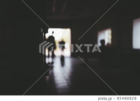 Abstract picture with several people silhouettes, dark unlit doom, doorway with light and window. Background with copy space for design. Concept of uncertainty, hope, unknown, expectation, chance. Abstract picture with several people silhouettes, dark unlit doom, doorway with light and window. Background with copy space for design. Concept of uncertainty, hope, unknown, expectation, chance. 95490929